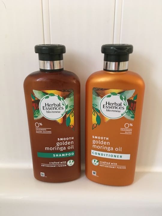 Full bottle of shampoo and conditioner OLIO