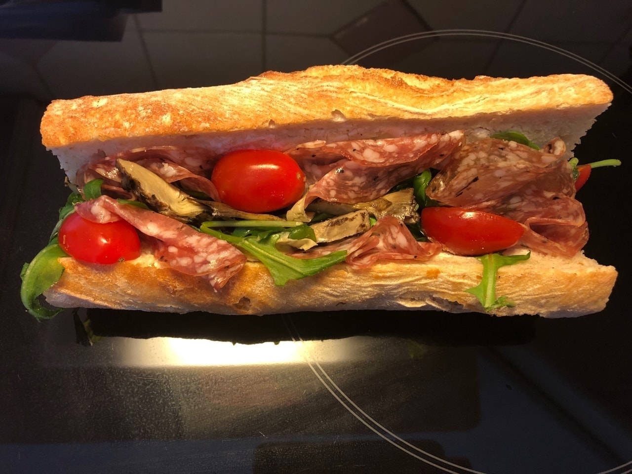 Baguette sandwich with salami, artichoke, cherry tomatoes and ruccola salad 🥖 kindly donated by